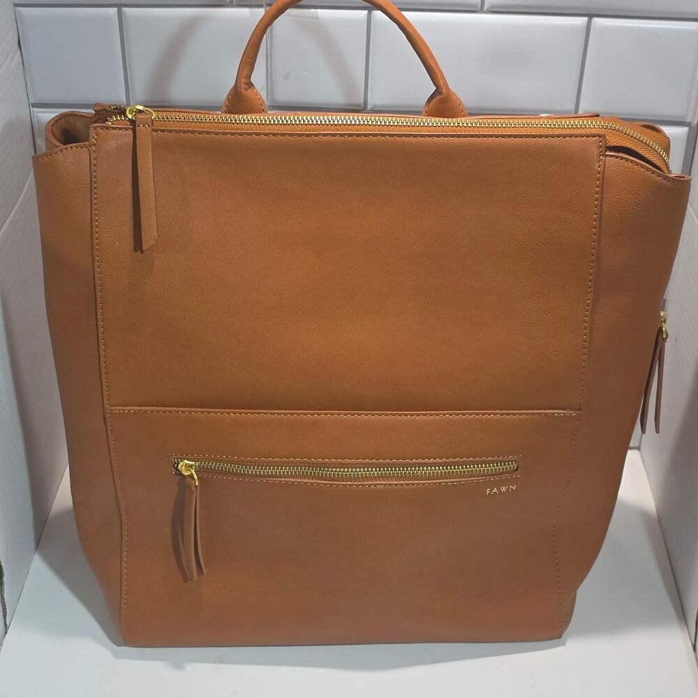 Fawn tan leather backpack with gold hardware